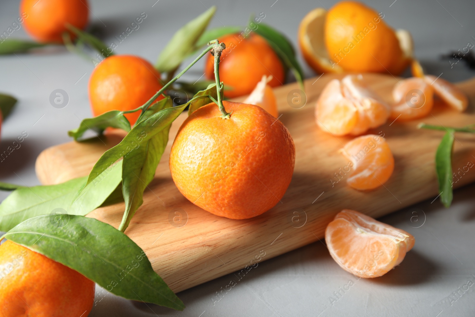 Photo of Ripe tangerines on table. Tasty citrus fruit