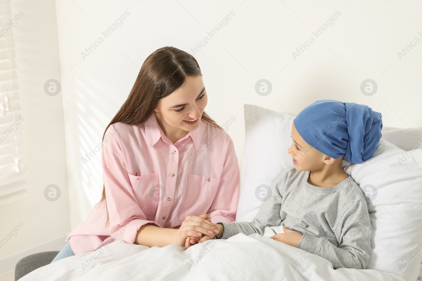 Photo of Childhood cancer. Mother and daughter in hospital