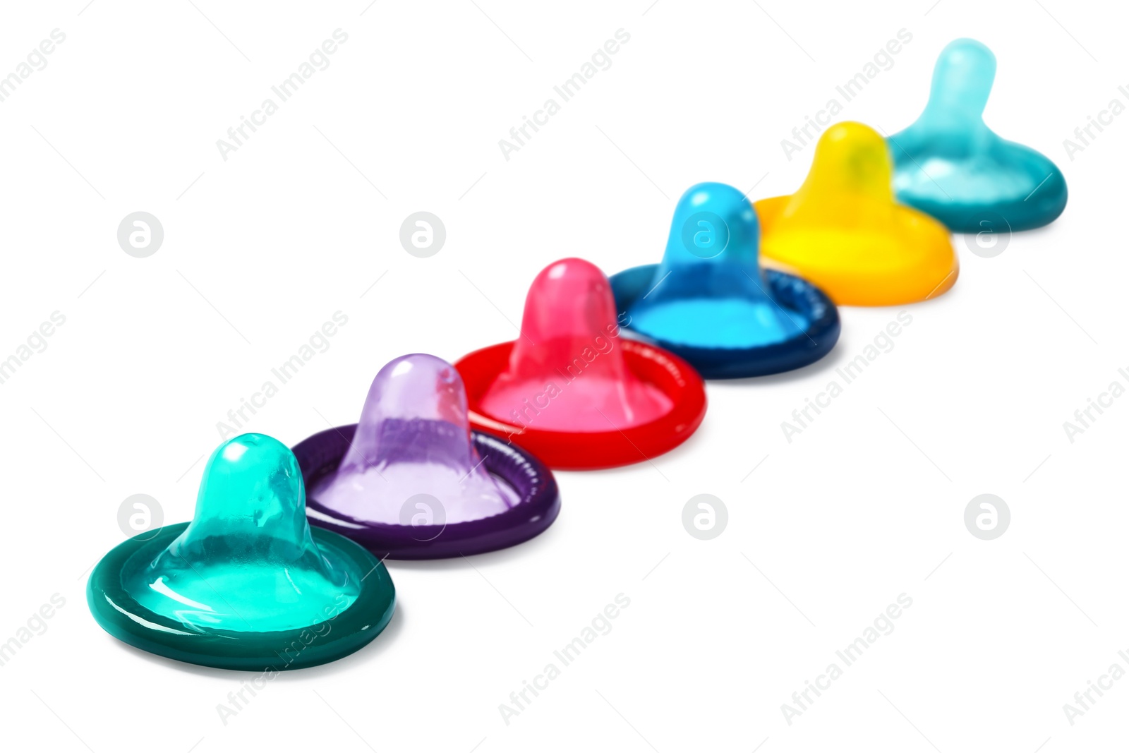 Photo of Colorful condoms isolated on white, closeup. Safe sex