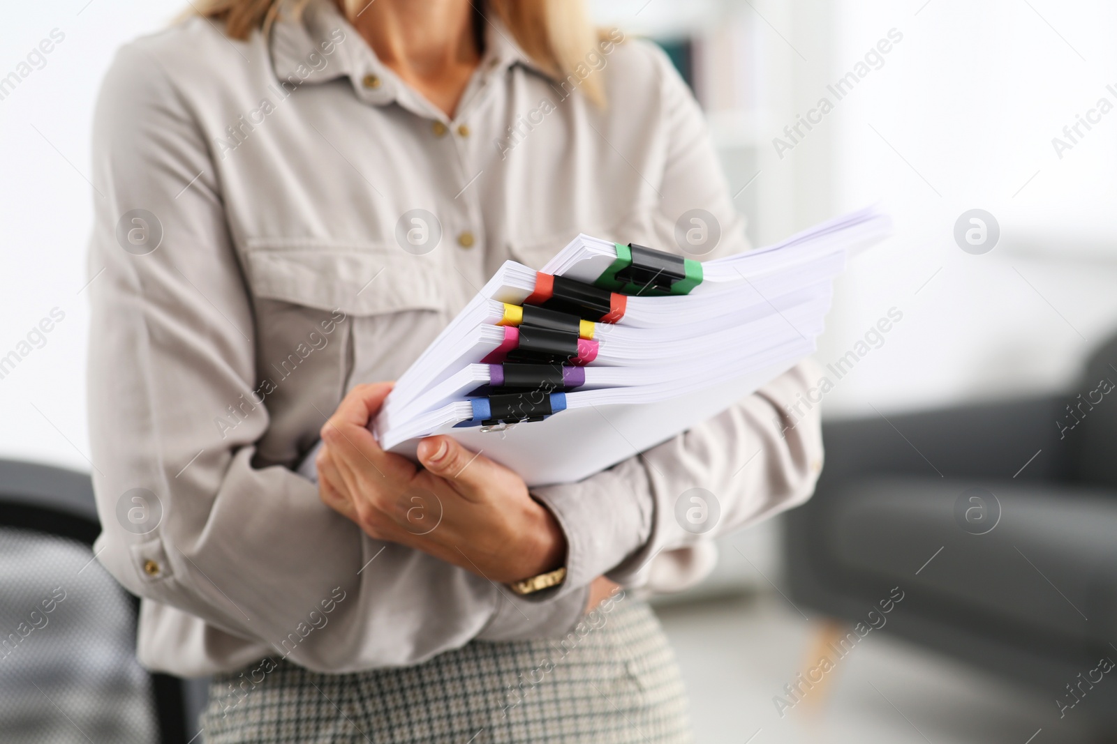 Photo of Businesswoman with documents in office, closeup view
