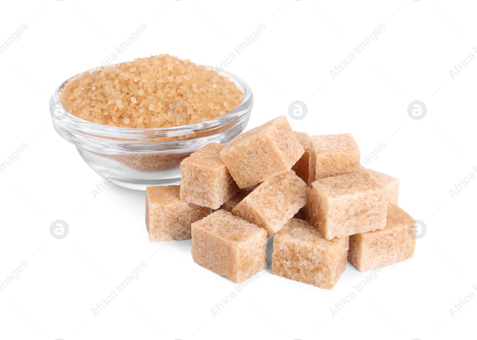 Photo of Different types of brown sugar and bowl isolated on white