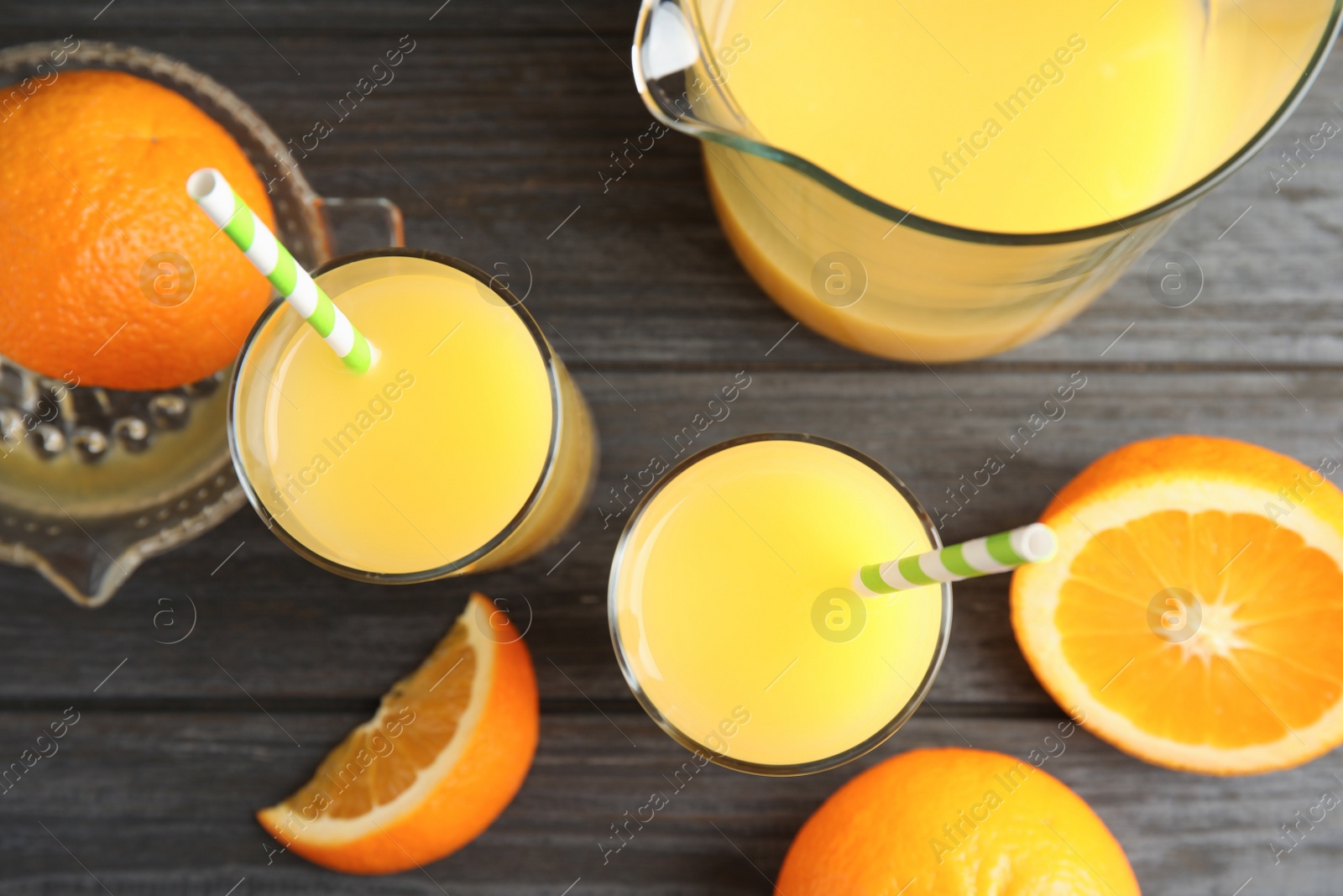 Photo of Flat lay composition with orange juice and fresh fruit on wooden background