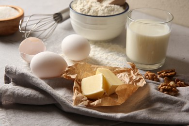 Different ingredients for dough on table, closeup