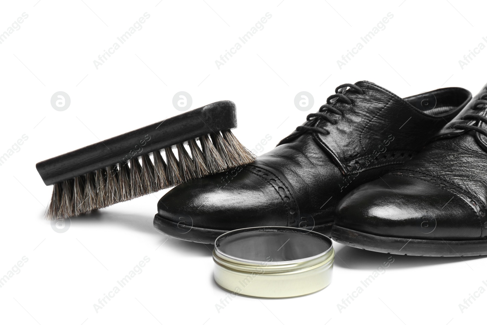 Photo of Stylish men's footwear and shoe care accessories on white background, closeup