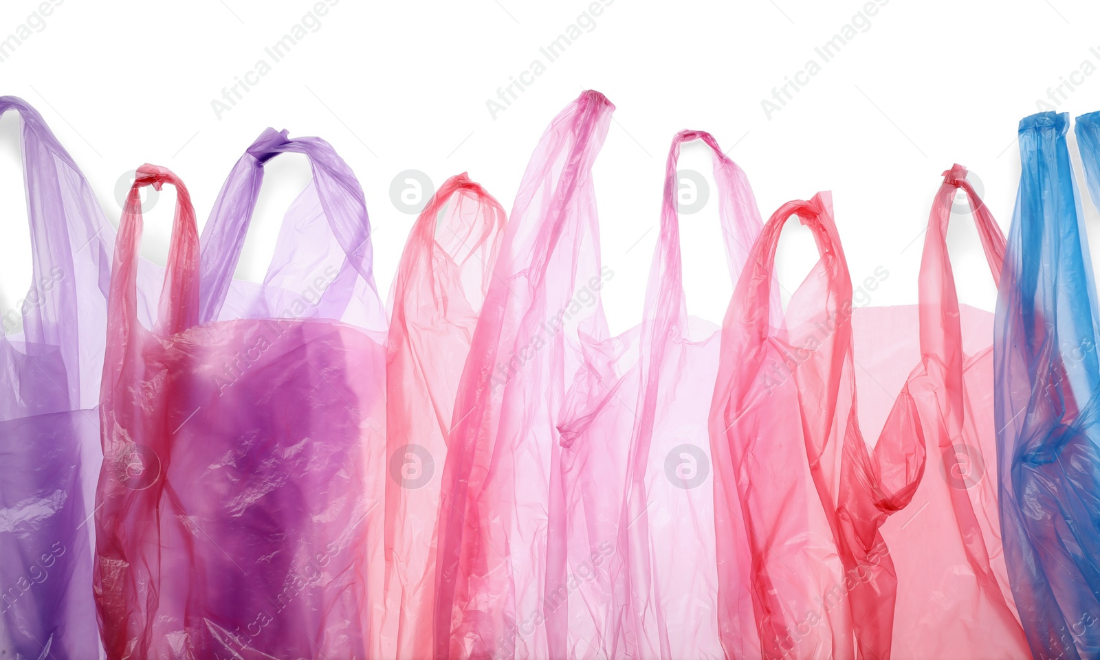 Photo of Many different plastic bags on white background