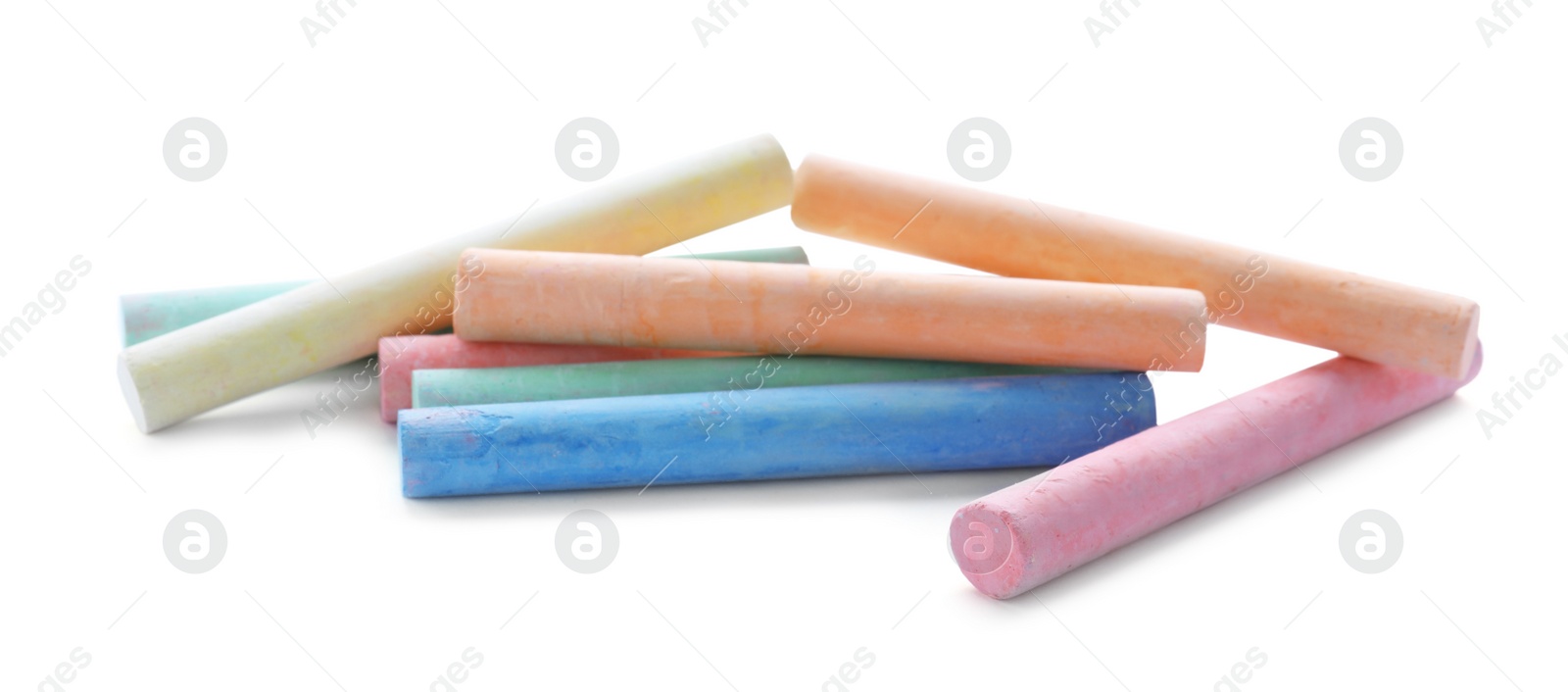 Photo of Color pieces of chalk on white background