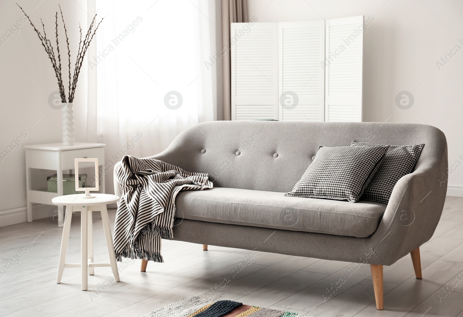 Photo of Cozy living room interior with comfortable sofa