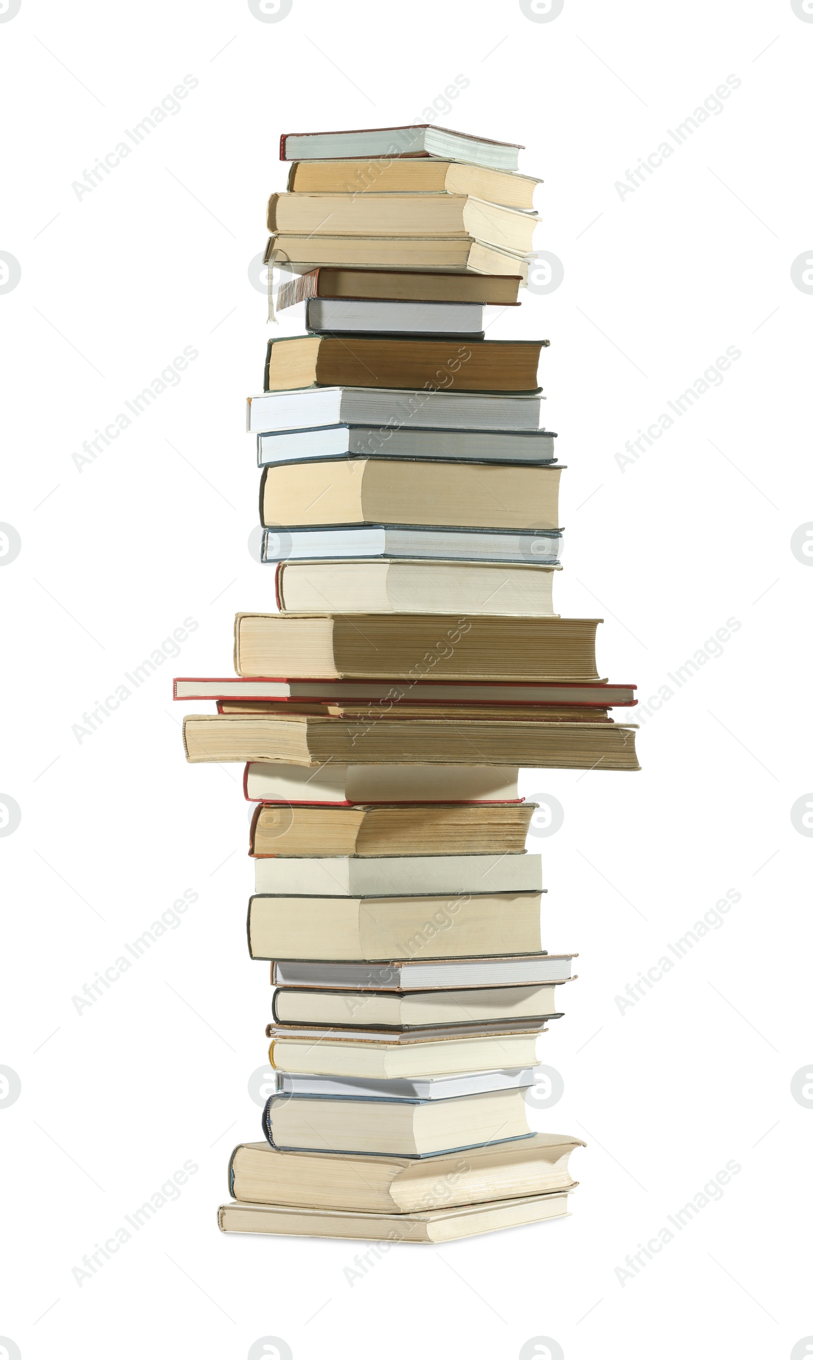 Photo of High stack of many different books isolated on white