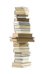 Photo of High stack of many different books isolated on white