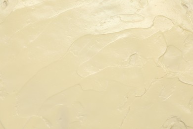 Photo of Texture of fresh natural butter as background, top view