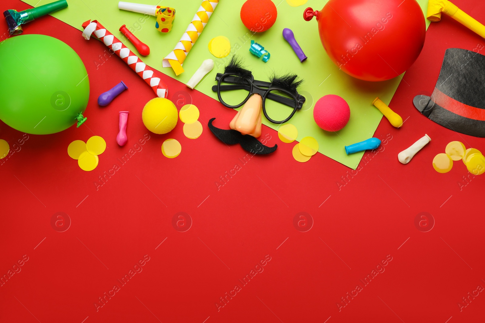 Photo of Flat lay composition with carnival items on color background. Space for text