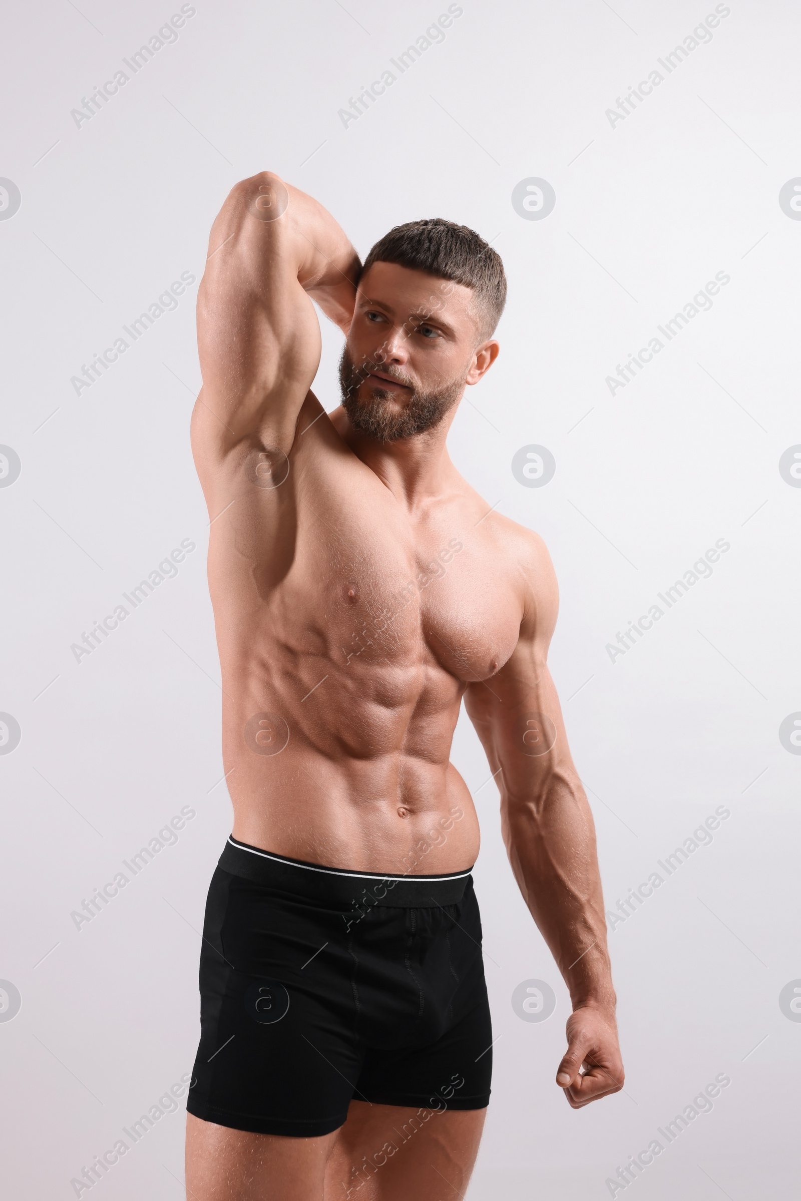 Photo of Young man is stylish black underwear on light grey background