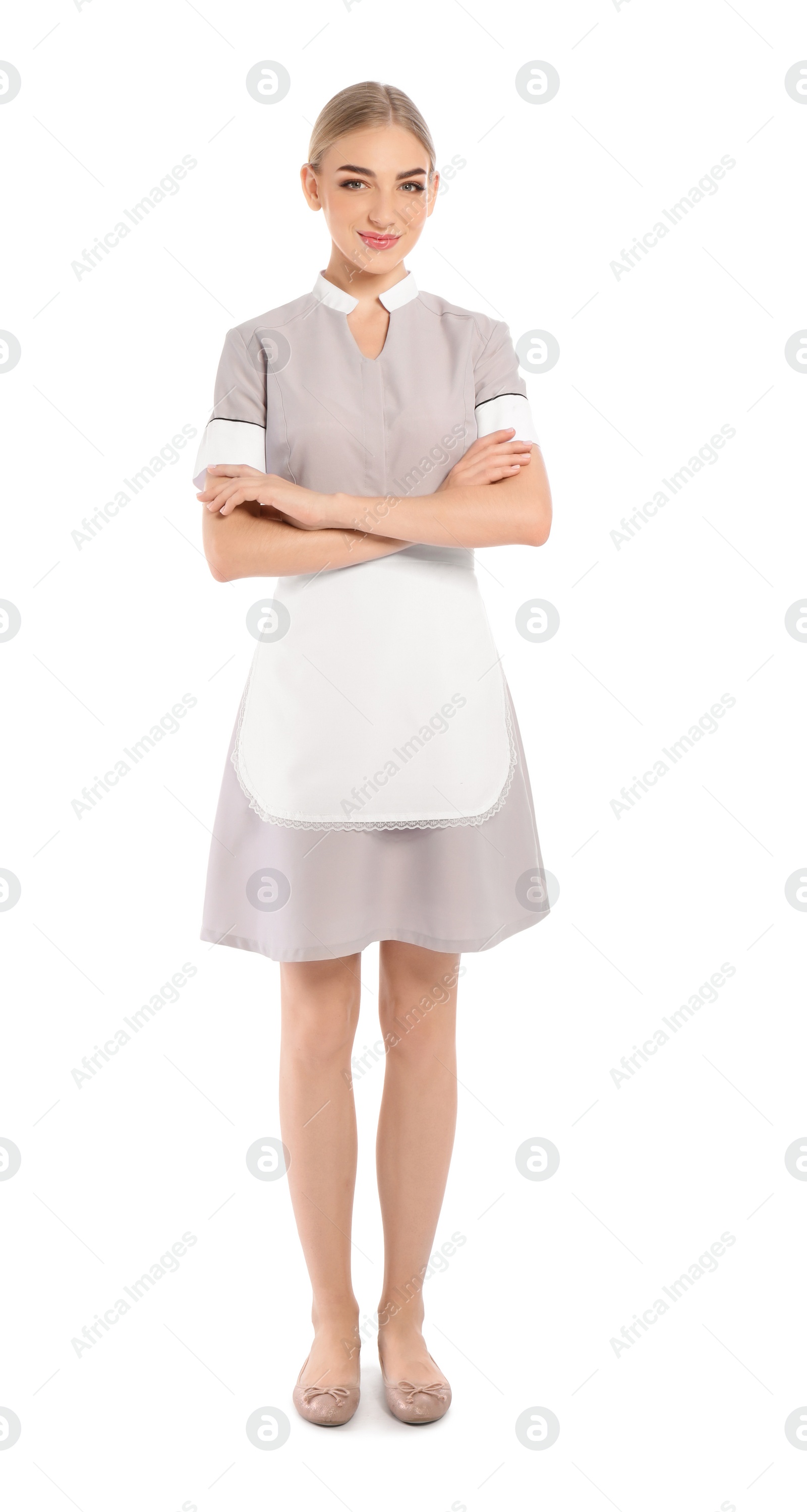 Photo of Full length portrait of young chambermaid in tidy uniform on white background