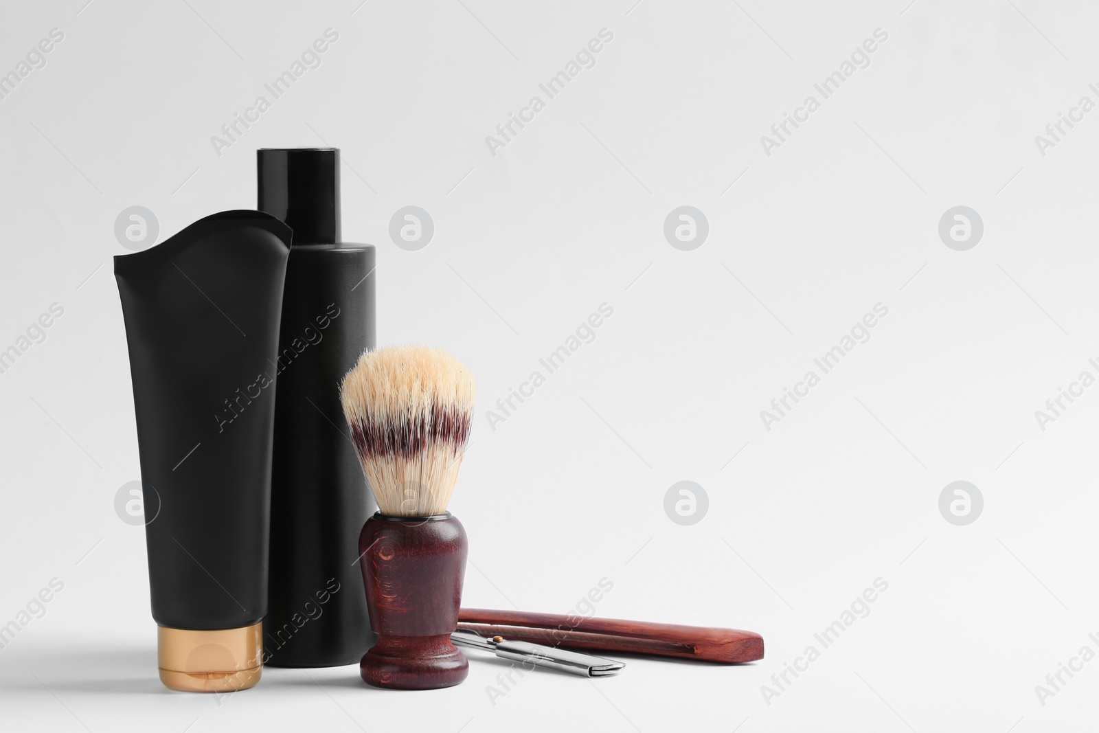 Photo of Set of shaving equipment and men's cosmetic products on light background. Space for design