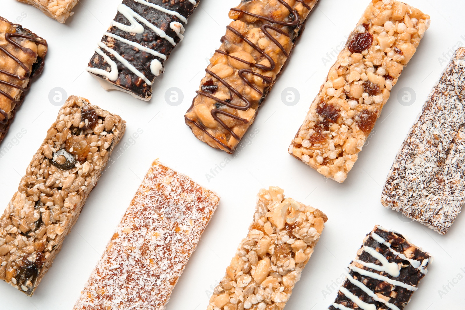 Photo of Different grain cereal bars on white background. Healthy snack