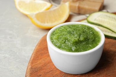 Handmade face mask and fresh ingredients on grey table, closeup