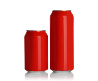 Photo of Red aluminum cans with drinks on white background