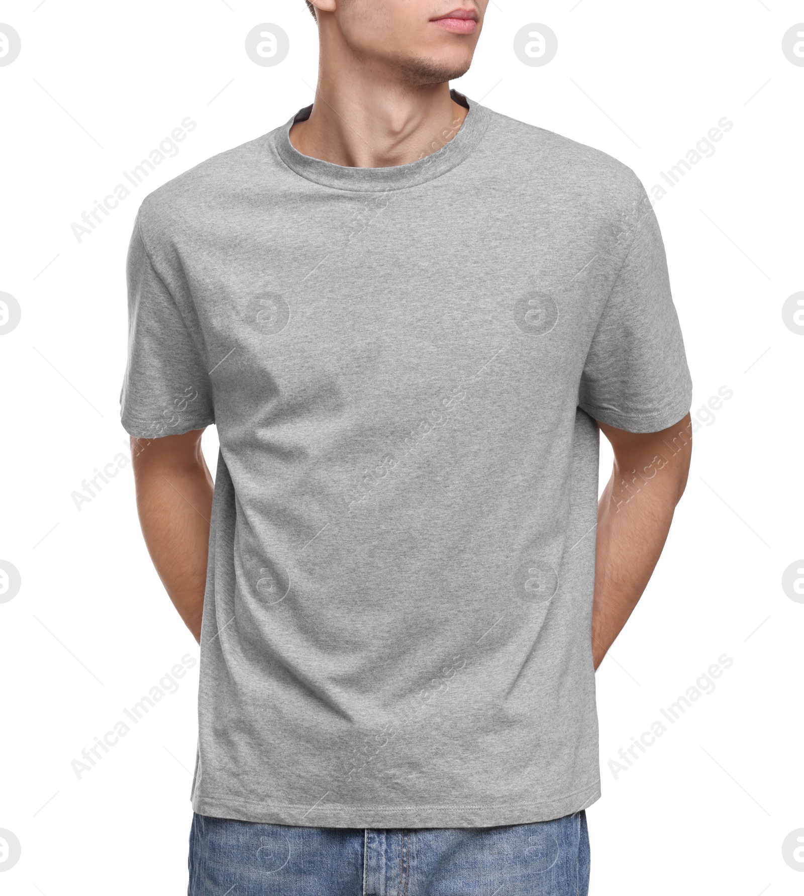 Photo of Young man wearing grey t-shirt on white background, closeup