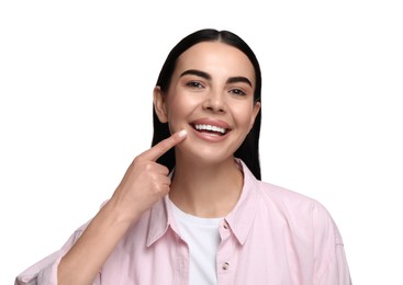 Beautiful woman with clean teeth smiling on white background