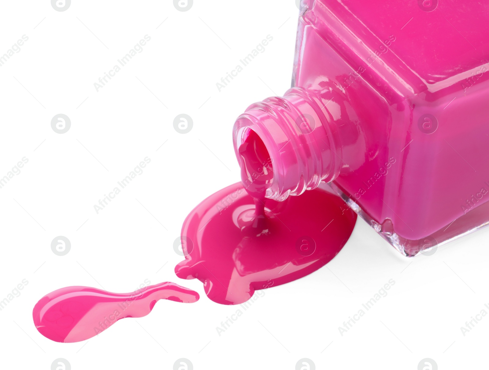 Photo of Bottle and spilled pink nail polish isolated on white