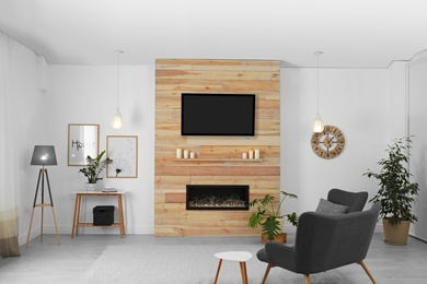 Living room interior with decorative fireplace in wooden wall