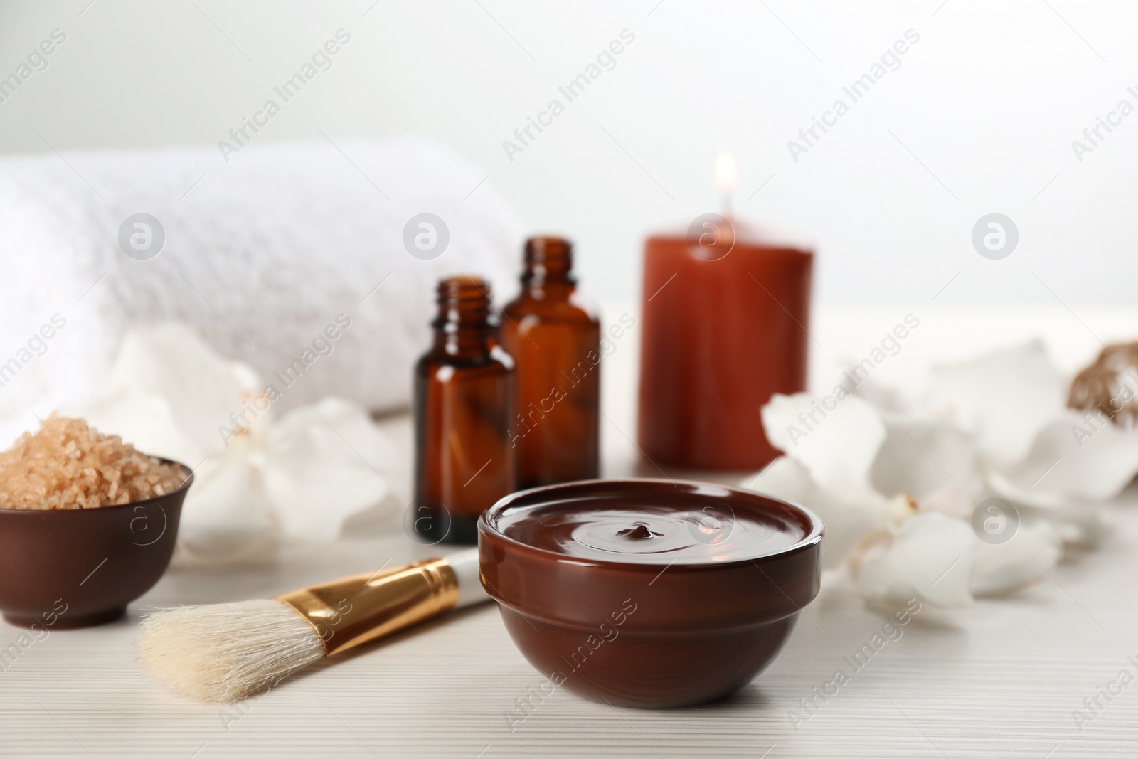 Photo of Composition with cosmetic product for spa body wraps on white wooden background