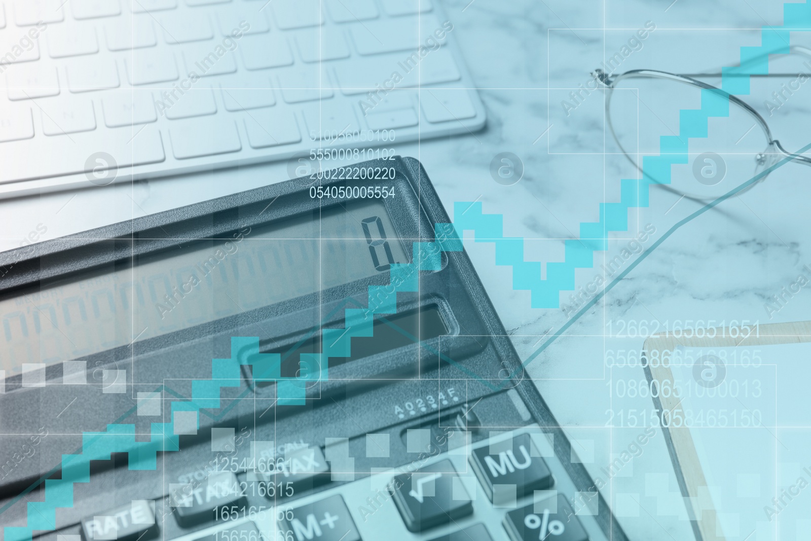 Image of Calculator, keyboard and glasses on white marble table, closeup