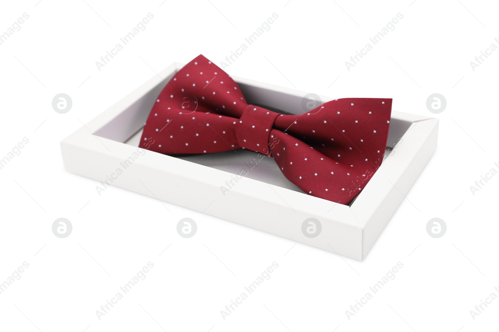 Photo of Stylish burgundy bow tie with polka dot pattern on white background