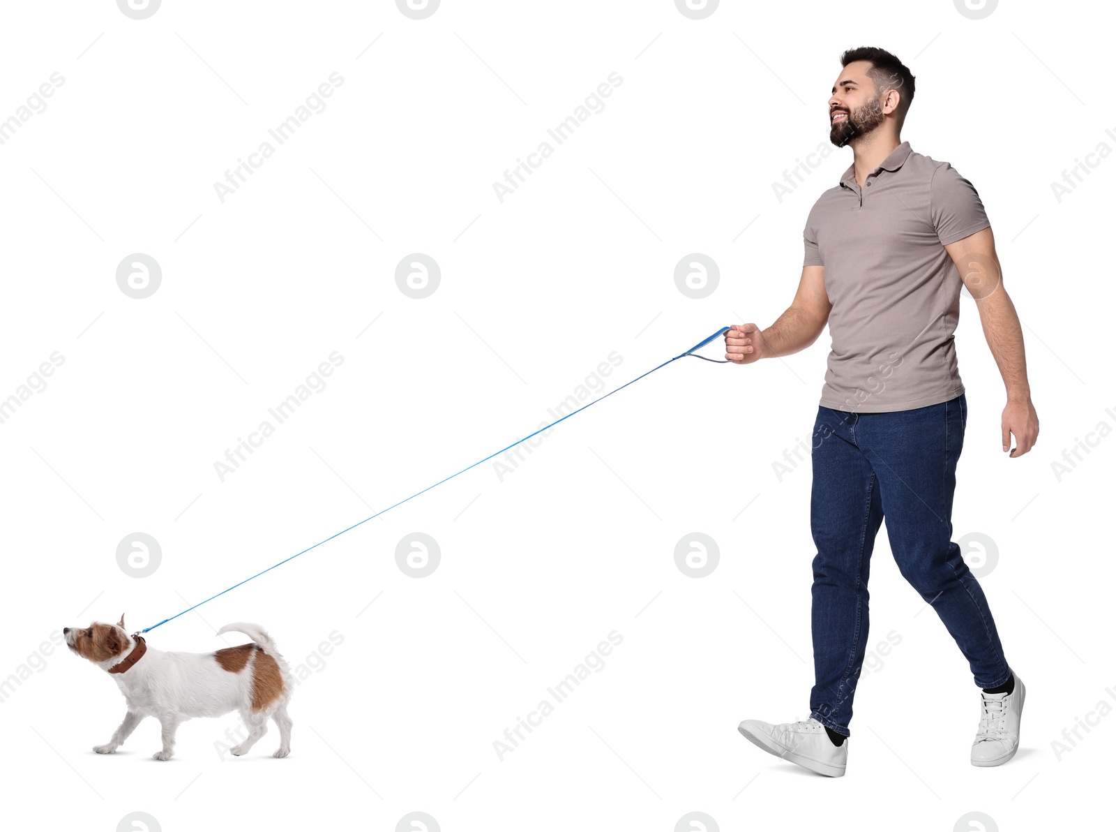 Image of Smiling man walking with dog on white background