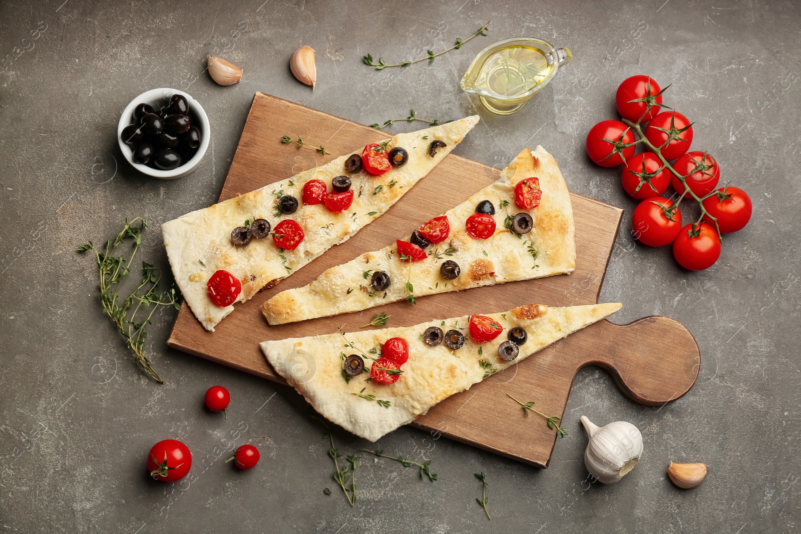 Photo of Flat lay composition with focaccia bread on grey table