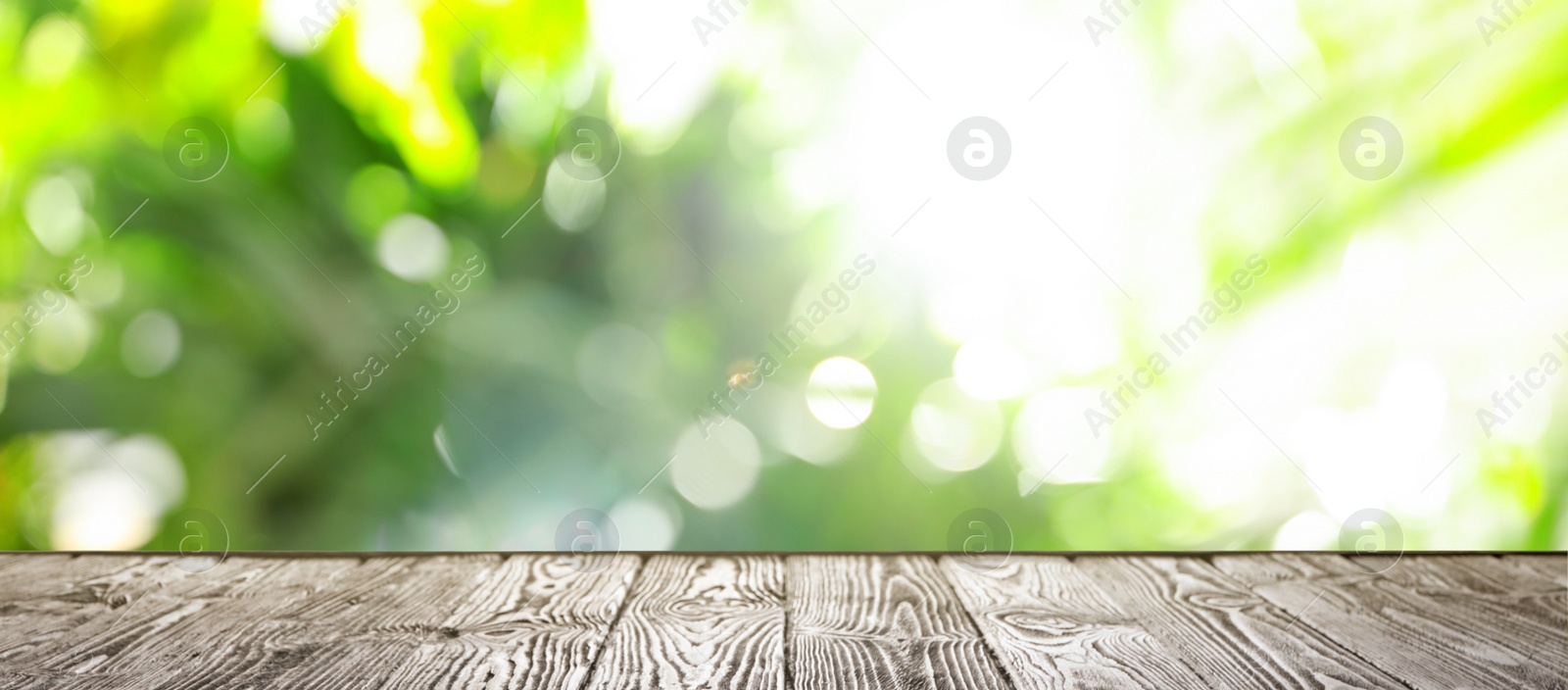 Image of Empty wooden surface against blurred background. Bokeh effect