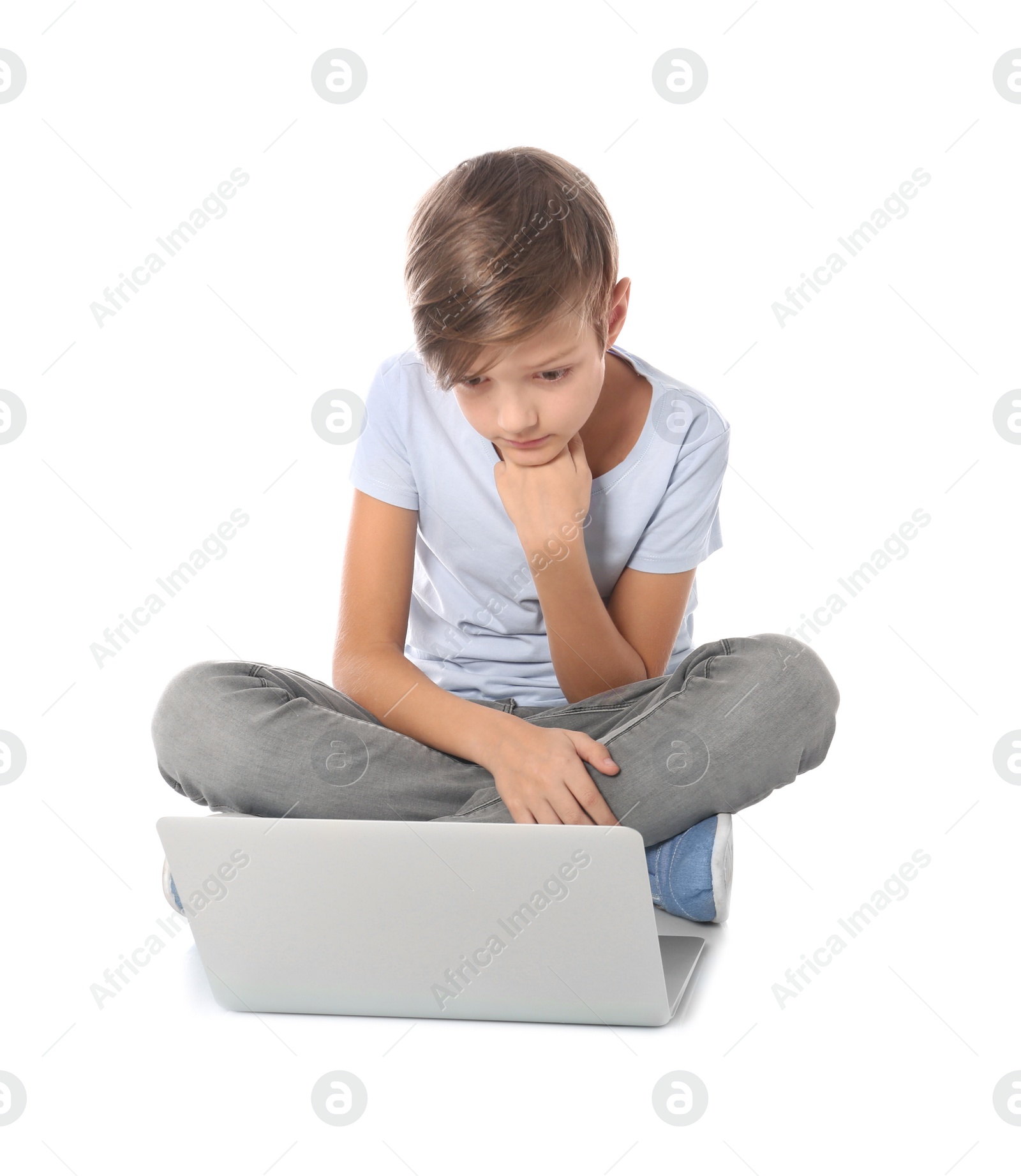 Photo of Child with laptop on white background. Danger of internet