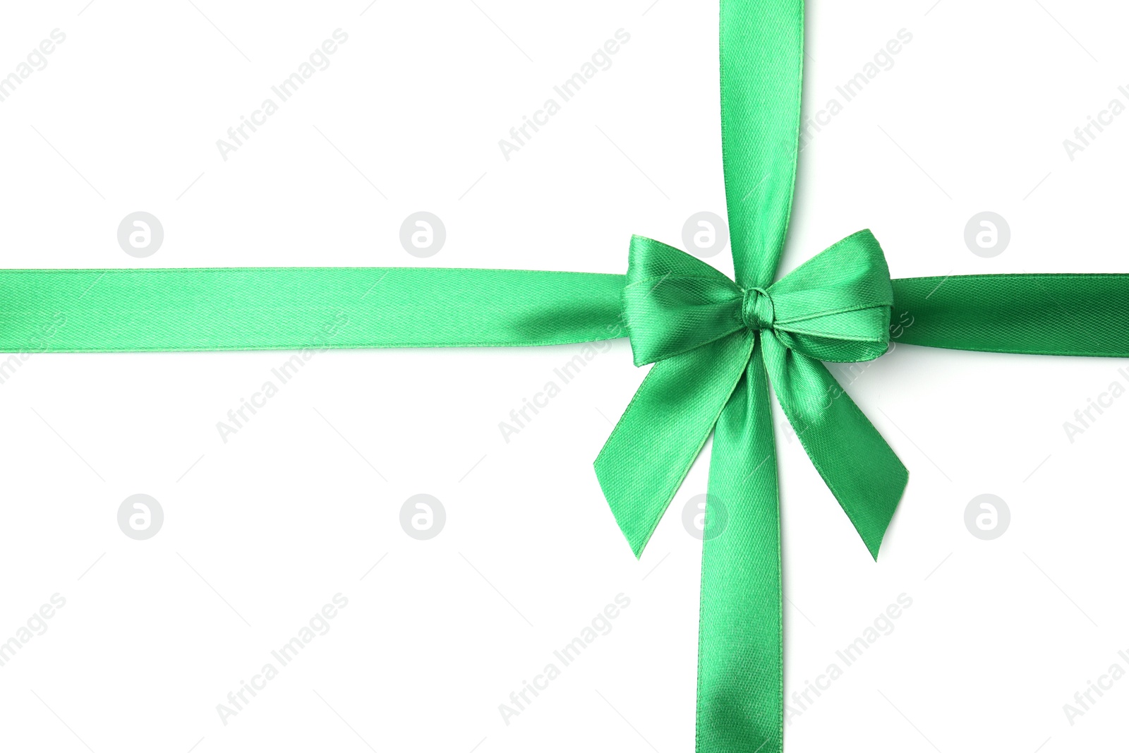 Photo of Green satin ribbon with bow isolated on white, top view