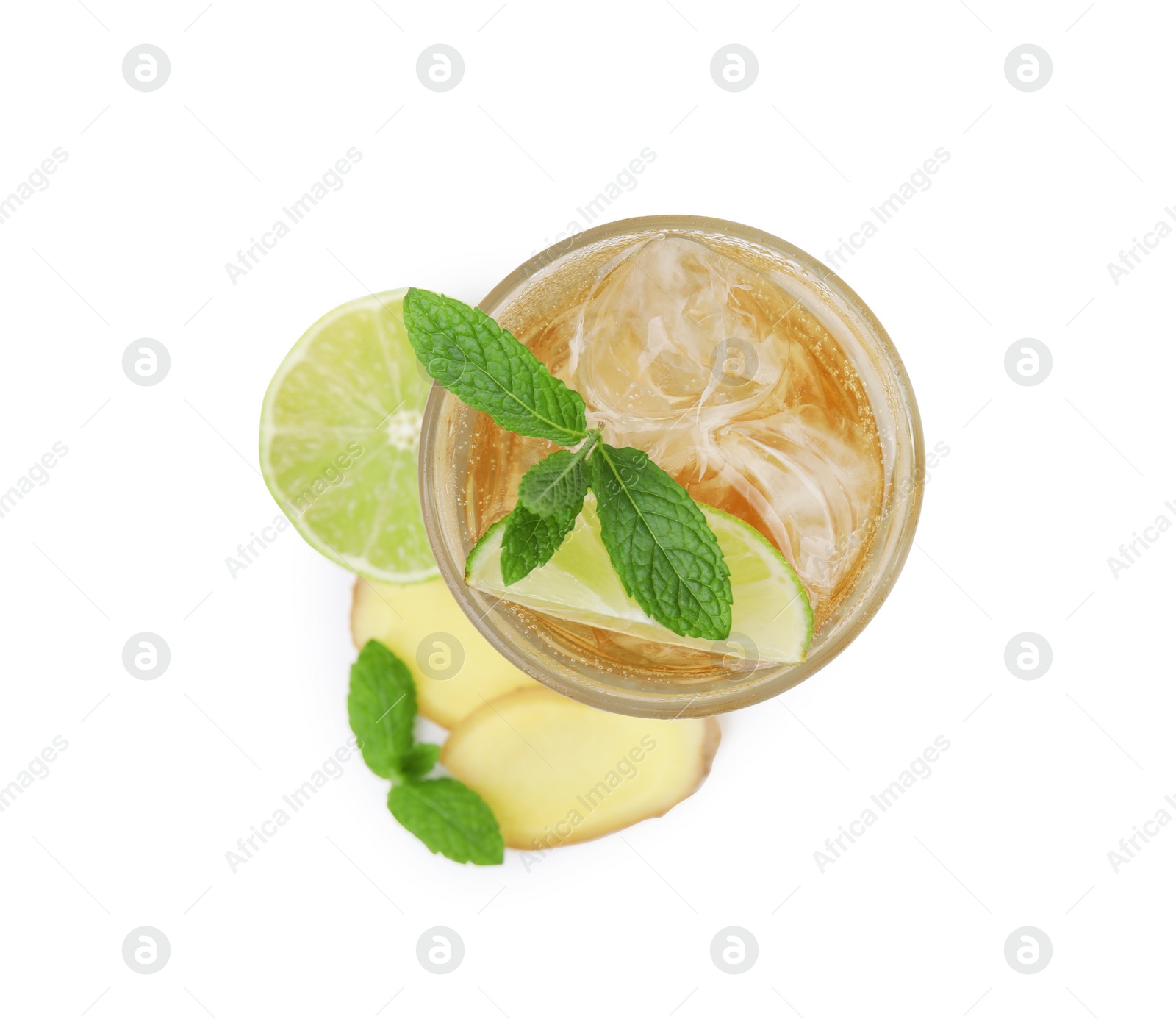 Photo of Glass of tasty ginger ale with ice cubes and ingredients isolated on white, top view