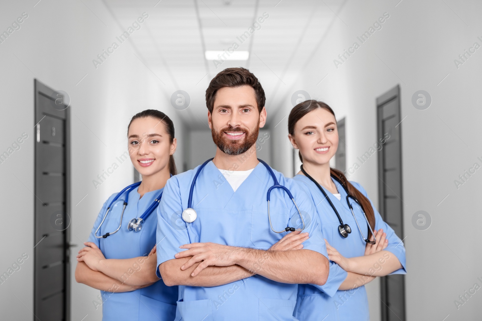 Photo of Team of smart medical students in college hallway