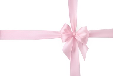 Photo of Pink satin ribbon with bow isolated on white, top view