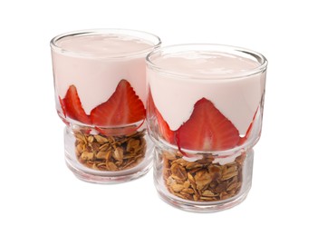 Photo of Glasses of tasty yogurt with muesli and strawberries isolated on white