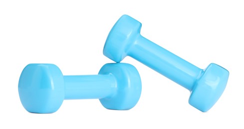 Photo of Light blue dumbbells isolated on white. Sports equipment