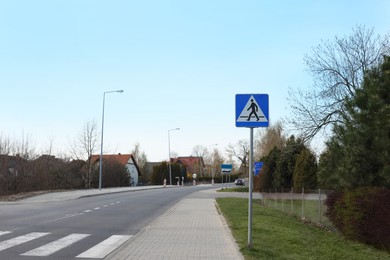 Photo of Traffic sign Pedestrian Crossing on city street, space for text