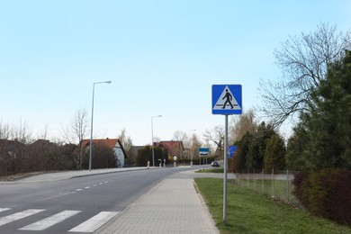 Traffic sign Pedestrian Crossing on city street, space for text