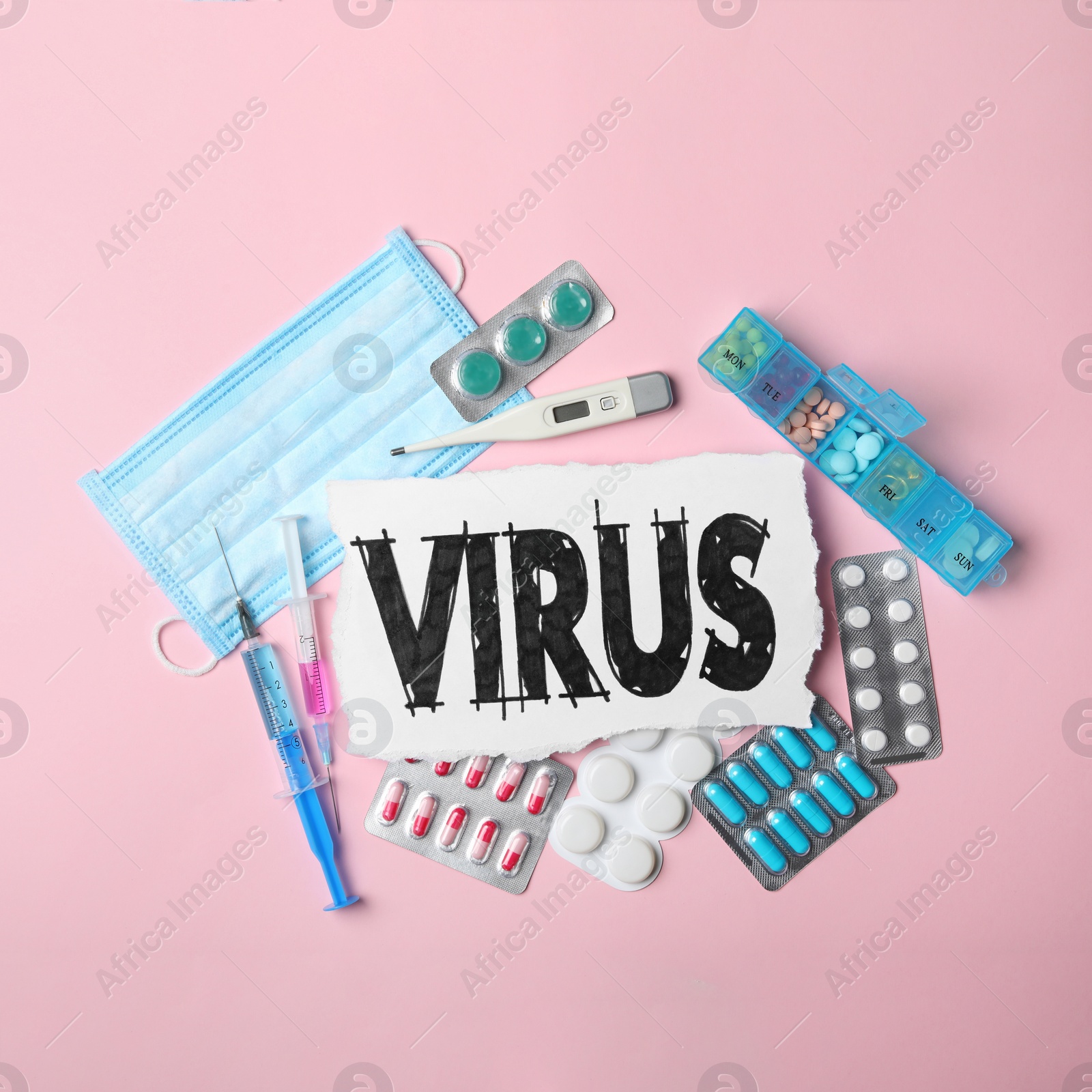 Photo of Flat lay composition with word VIRUS and medicines  on pink background