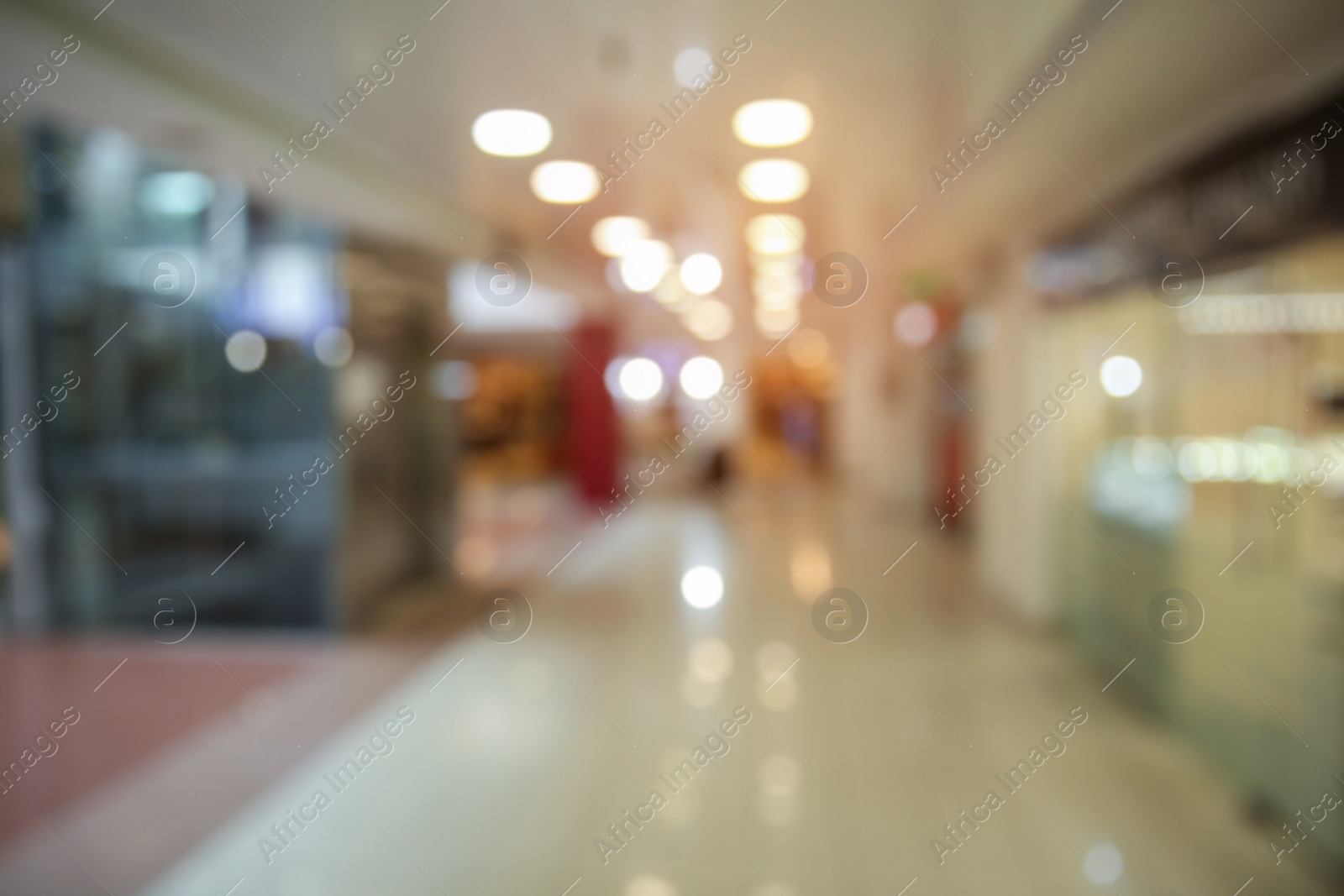 Photo of Blurred view of shopping mall entrance hall interior