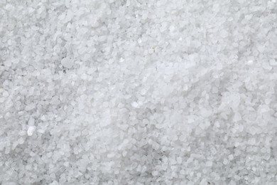 Photo of White natural salt as background, top view