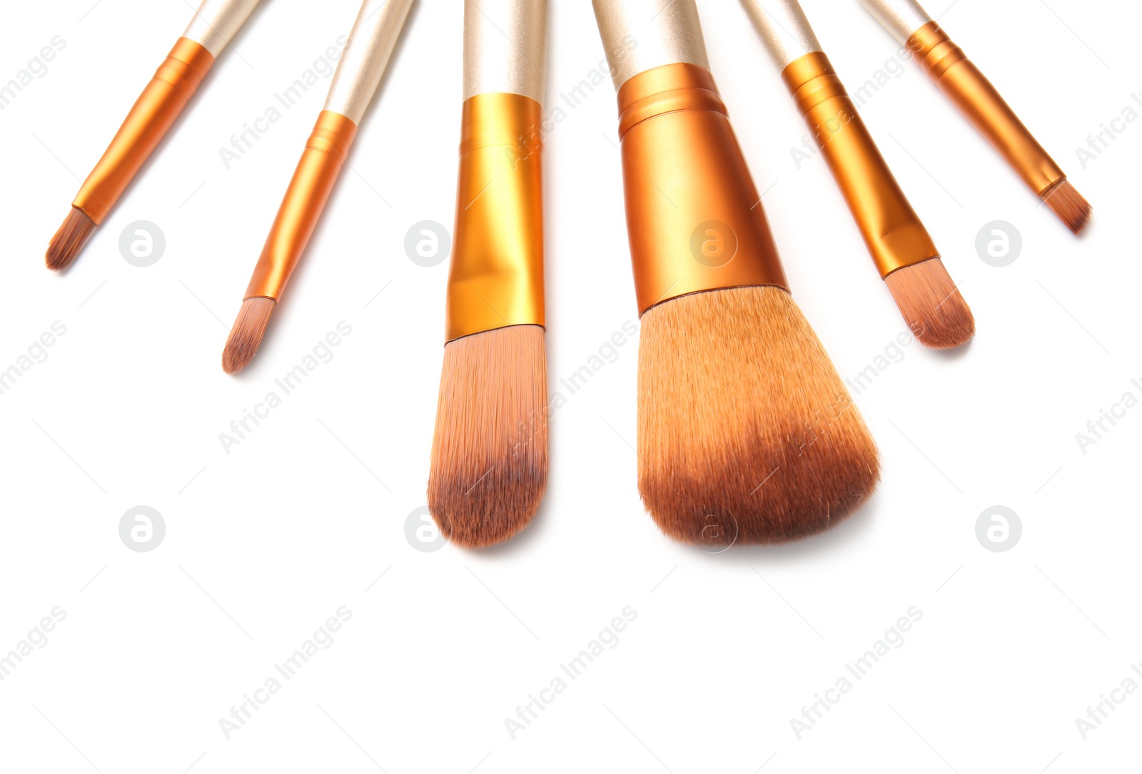 Photo of Makeup brushes of professional artist on white background