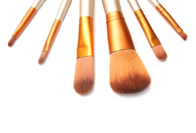 Photo of Makeup brushes of professional artist on white background