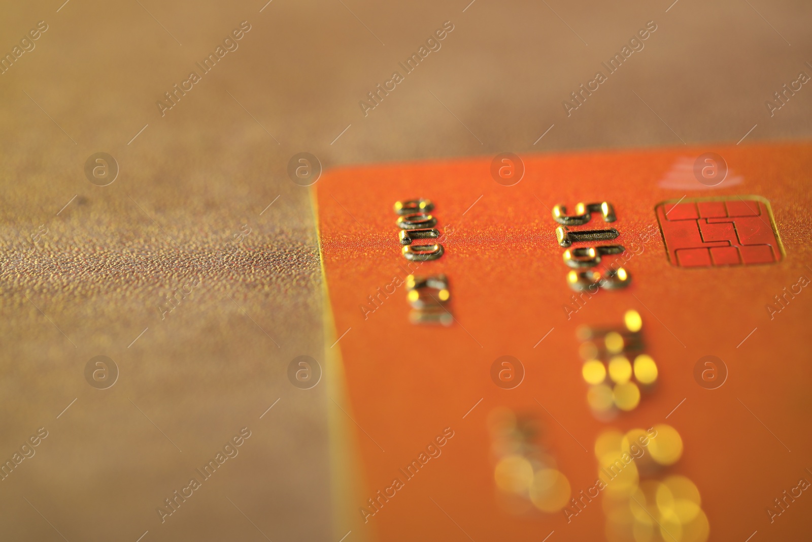 Photo of Plastic credit card on table, macro view. Space for text