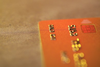 Photo of Plastic credit card on table, macro view. Space for text