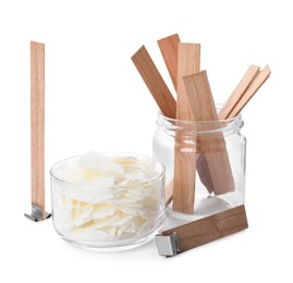 Photo of Wax flakes and wooden wicks on white background. Making homemade candle