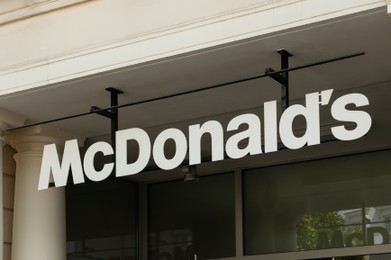 Photo of WARSAW, POLAND - JULY 19, 2022: Signboard with McDonald's Restaurant logo outdoors