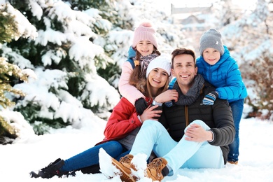 Photo of Portrait of happy family in winter park